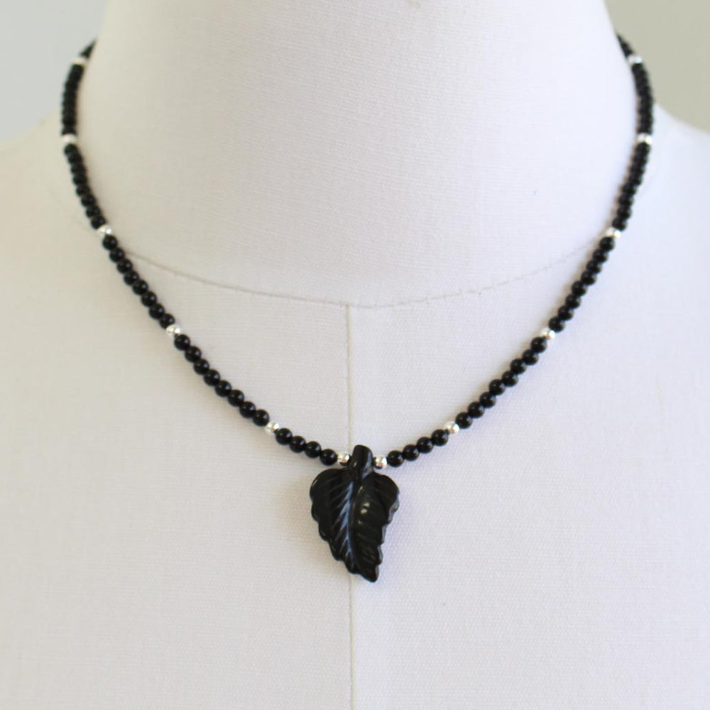 
                      
                        Black Onyx Necklace with Hand Carved Onyx Leaf
                      
                    