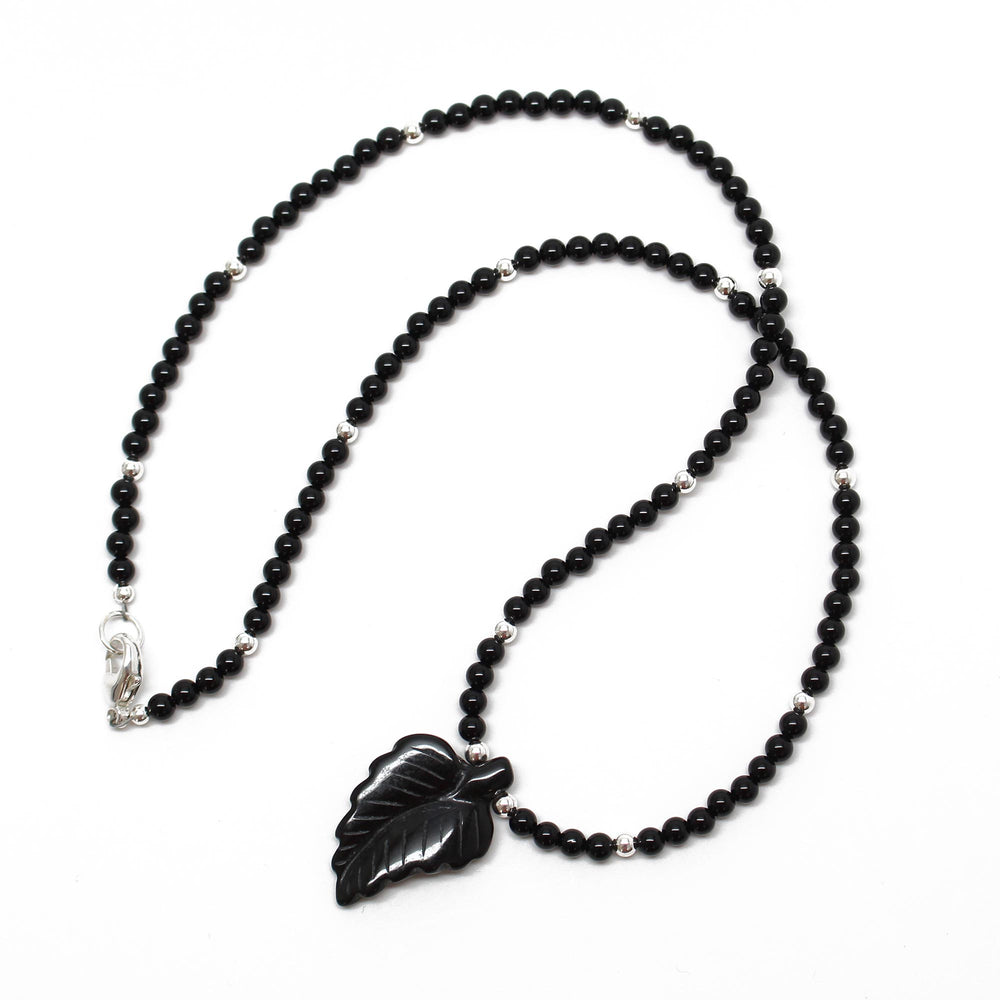 
                      
                        Black Onyx Necklace with Hand Carved Onyx Leaf
                      
                    