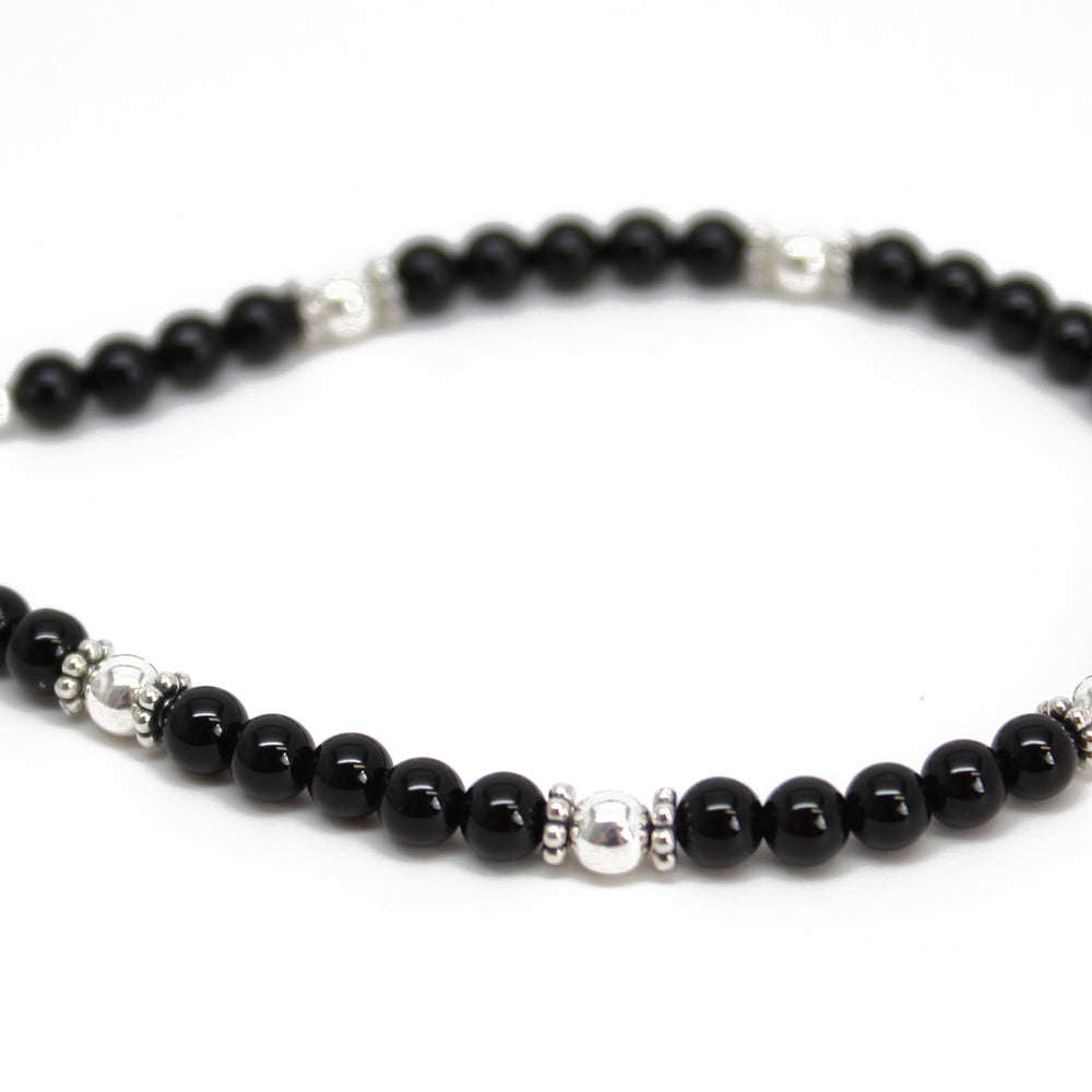 
                      
                        Black Onyx and Sterling Silver Bead Bracelet
                      
                    