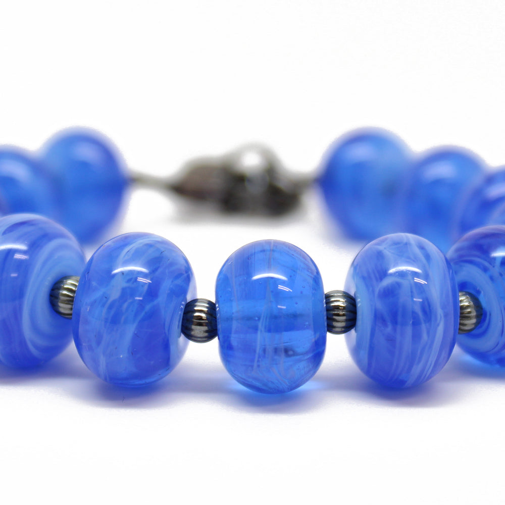 
                      
                        Blue Lampwork Bead Bracelet with Turtle Charm
                      
                    