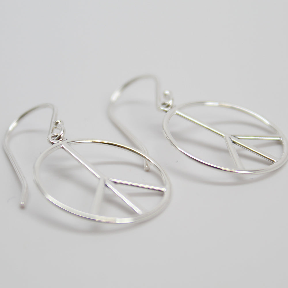 
                      
                        Peace Sign Dangle Earrings in Sterling Silver
                      
                    