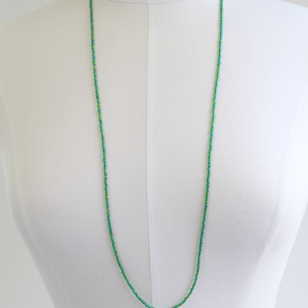 
                      
                        Transparent Rainbow Emerald Green Seed Bead Necklace, Thin 1.5mm Single Strand
                      
                    