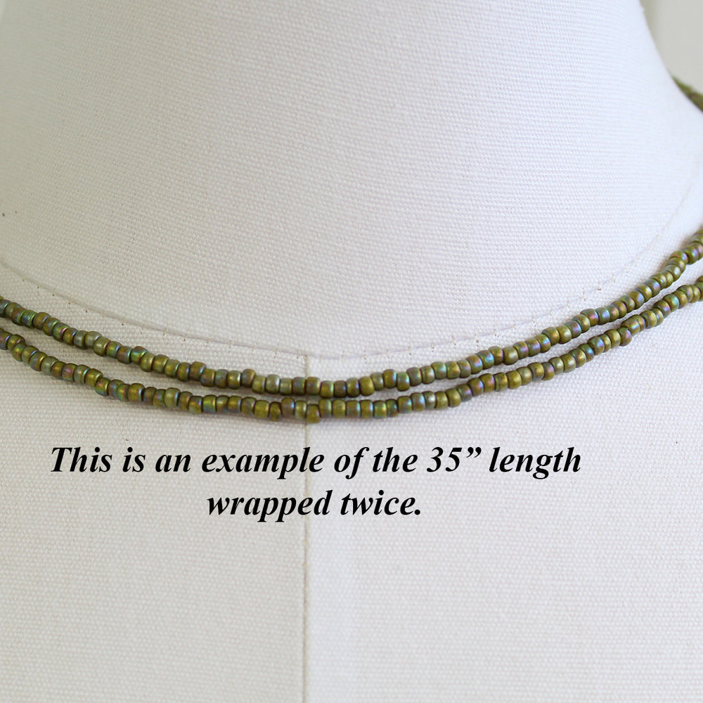 
                      
                        Semi Glazed Olive Green Seed Bead Necklace
                      
                    