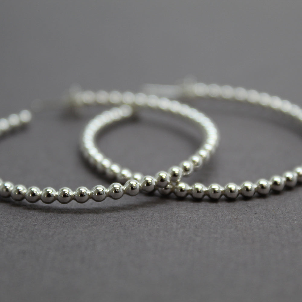 
                      
                        Sterling Silver Ball Wire Hoop Earrings
                      
                    