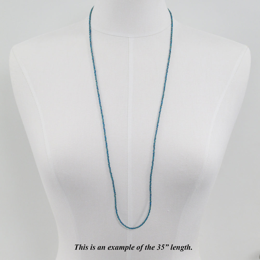 
                      
                        Transparent Rainbow Teal Seed Bead Necklace, Thin 1.5mm Single Strand
                      
                    