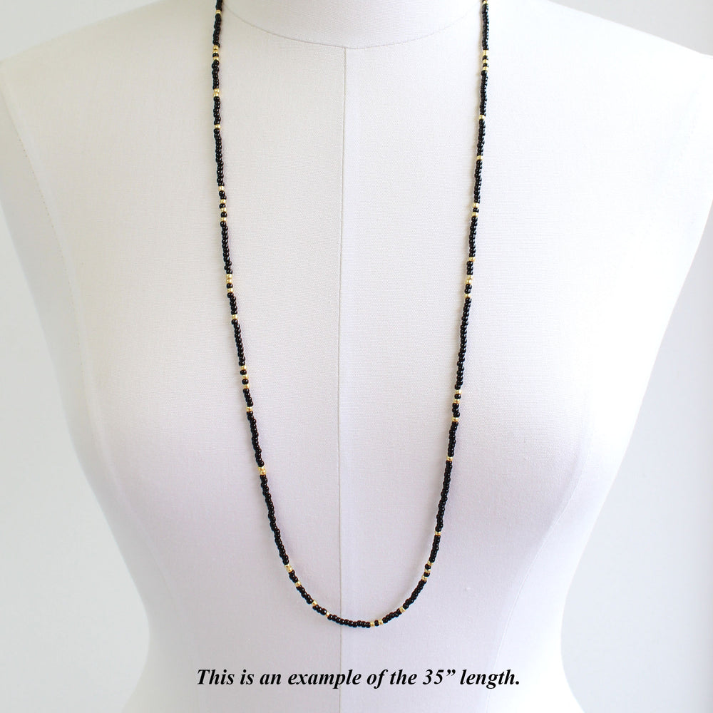 
                      
                        Black and Gold Seed Bead Necklace-Single Strand
                      
                    