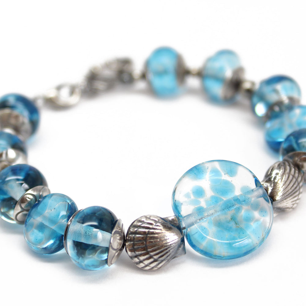 
                      
                        Blue Beaded Bracelet with Sterling Silver Shells
                      
                    