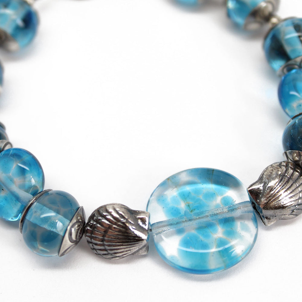 
                      
                        Blue Beaded Bracelet with Sterling Silver Shells
                      
                    
