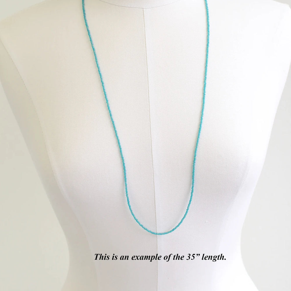 
                      
                        Matte Transparent Turquoise Seed Bead Necklace, Thin 1.5mm Single Strand
                      
                    