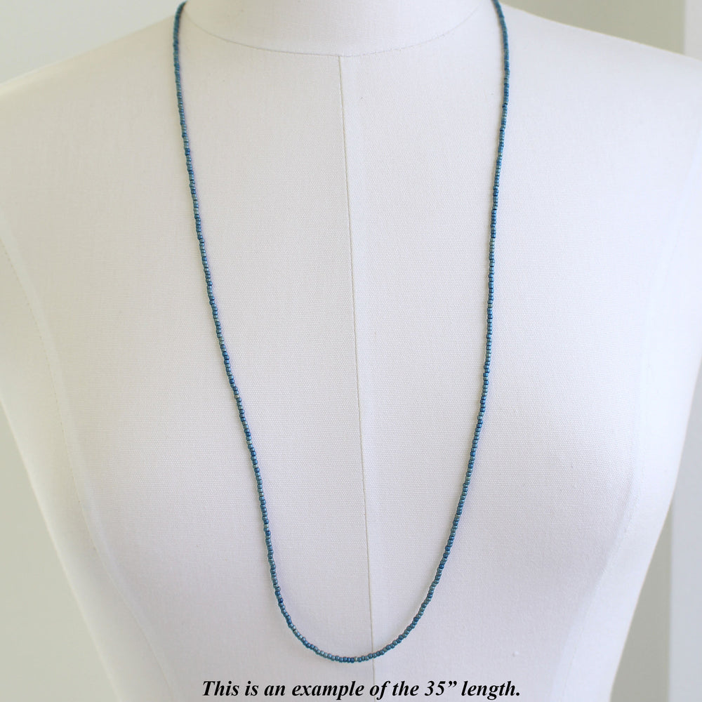
                      
                        Long Blue Seed Bead Necklace
                      
                    