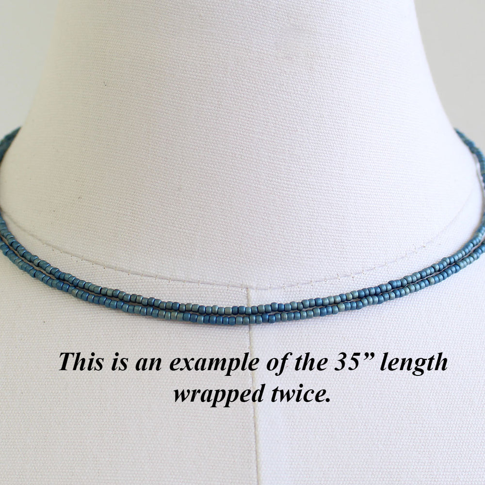 
                      
                        Tiny blue choker
                      
                    