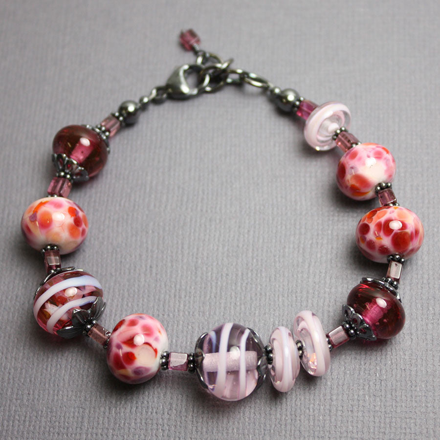 
                      
                        Pink Lampwork Bead Bracelet with Tourmaline
                      
                    