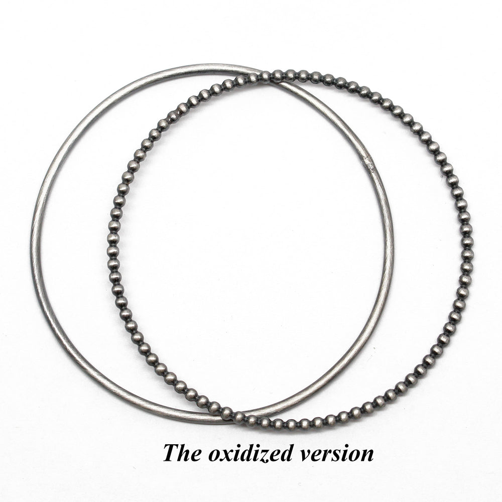 
                      
                        Sterling Silver Bangle Set
                      
                    