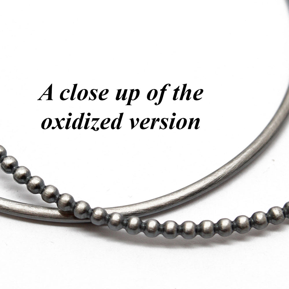 
                      
                        Oxidized Sterling Silver Bangle Set
                      
                    